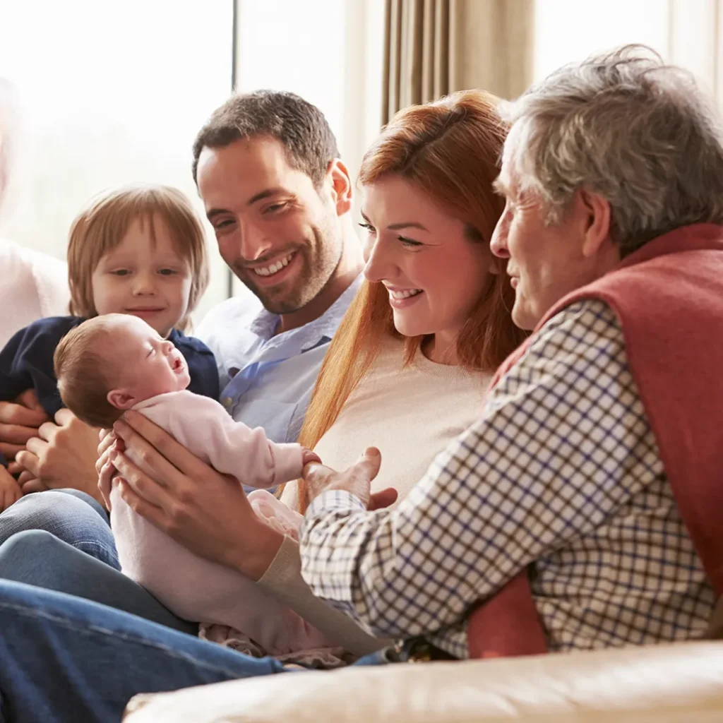 Family holding a child